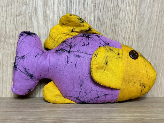 Meet Fioly the Fish, radiating vibrant energy and looking for a cozy home in a world filled with joy!