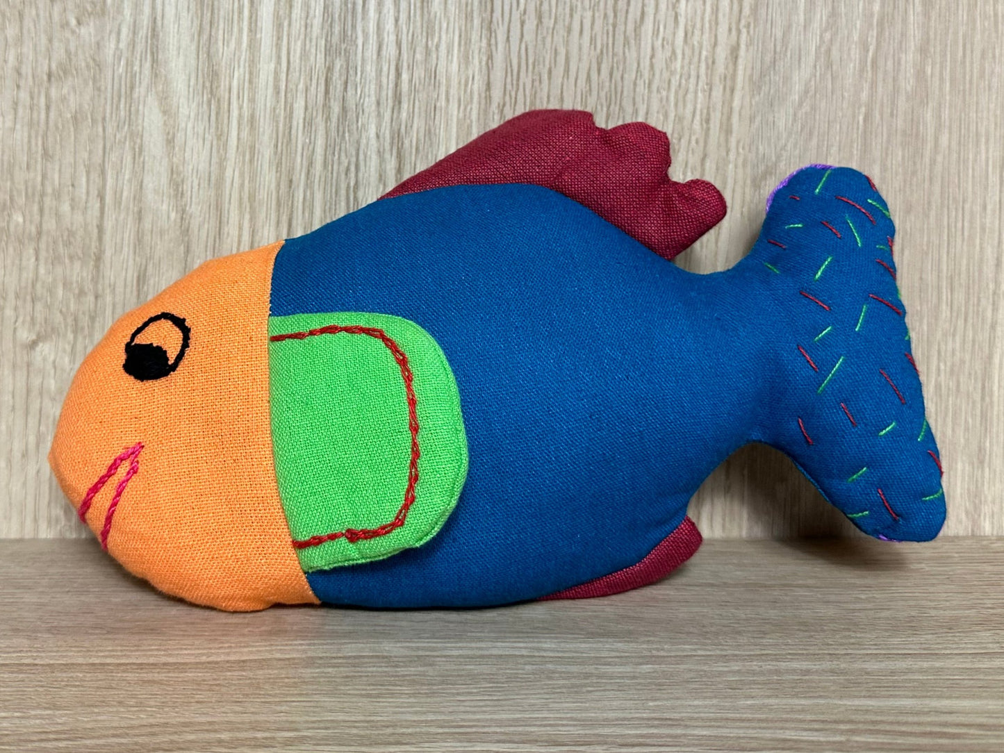 Meet Fioly the Fish, radiating vibrant energy and looking for a cozy home in a world filled with joy!