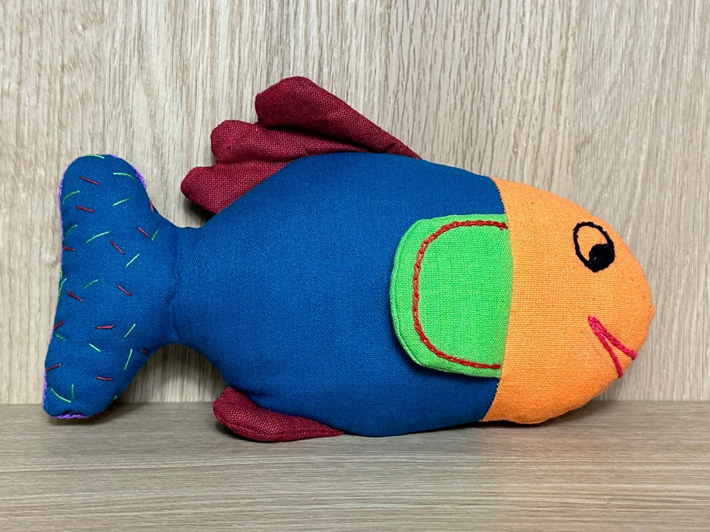 Meet Fioly the Fish, radiating vibrant energy and looking for a cozy home in a world filled with joy!